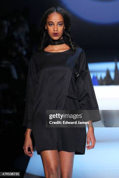 Model walks the runway during the Matiere Noir fashion show during World Mastercard fashion week on March 18, 2014 in Toronto, Canada.