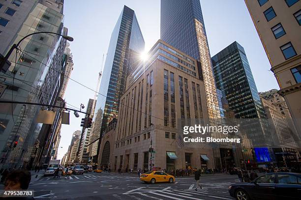 Taxi drives past the Tiffany and Co. Flagship store in New York, U.S., on Tuesday, March 18, 2014. Tiffany & Co. Is expected to release earnings...
