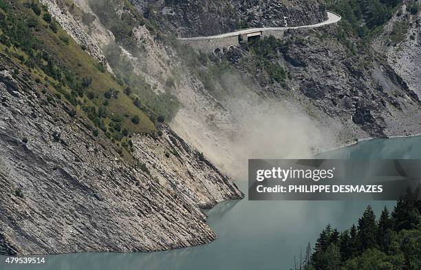 French gendarmerie helicopter flies over a crevice formed by a landslide above the Chambon lake and the Chambon tunnel above the Chambon lake and the...