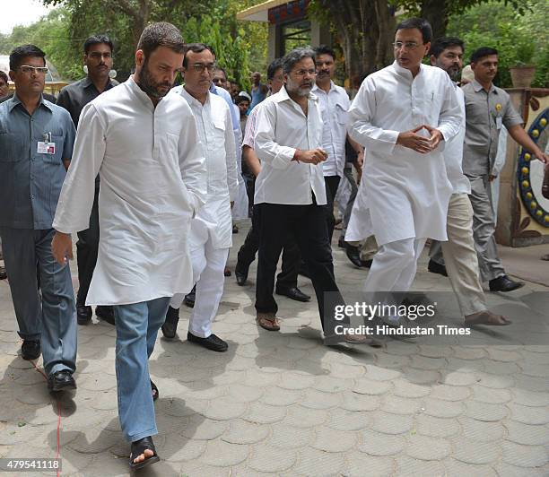 Congress Vice-President Rahul Gandhi with party leaders Ajay Maken and Randeep Surjewala leaves after the cremation of slain Journalist Akshay Singh...