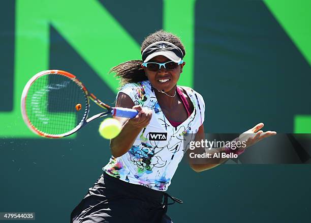 Victoria Duval of the USA returns a shot against Kiki Bertens of the Netherlands during their match on day 3 of the Sony Open at Crandon Park Tennis...