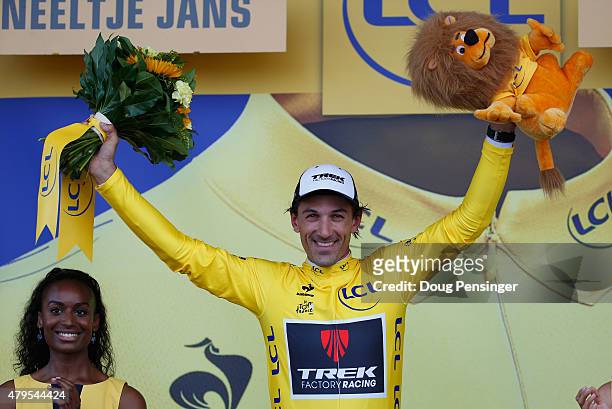 Fabian Cancellara of Switzerland and Trek Factory Racing celebrates as he is awarded the yellow jersey on the podium after stage two of the 2015 Tour...