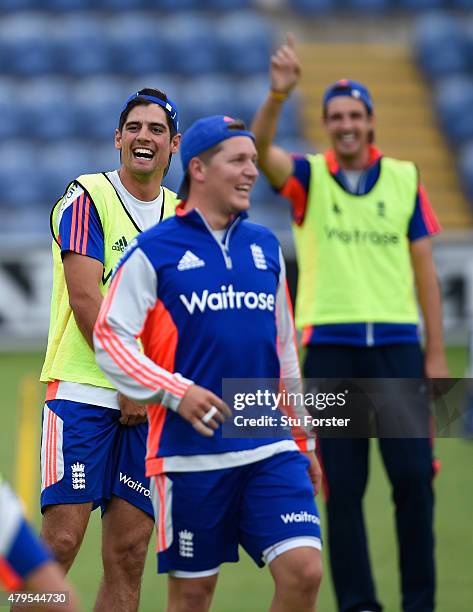 England captain Alastair Cook shares a joke with Gary Ballance and Steven Finn during England net practice at the Swalec stadium on July 5, 2015 in...