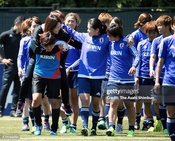 Homare Sawa and injured Kozue Ando talk after a training session ahead of the FIFA Women's World Cup final match against the United States on July 4,...