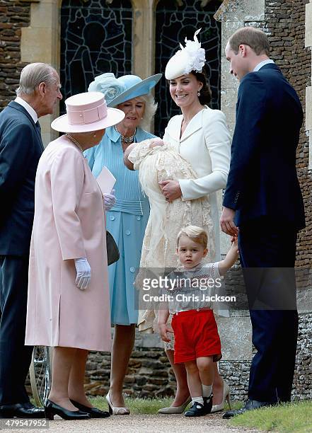 Catherine, Duchess of Cambridge, Prince William, Duke of Cambridge, Princess Charlotte of Cambridge and Prince George of Cambridge talk to Queen...
