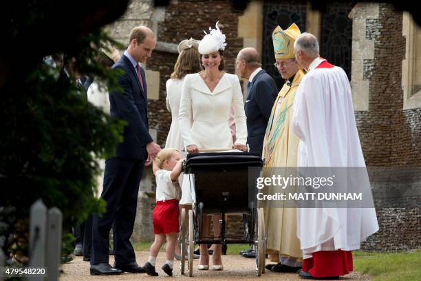 Prince George of Cambridge looks at his sister as his mother, Britain's Catherine, Duchess of Cambridge, father Prince William, Duke of Cambridge ,...