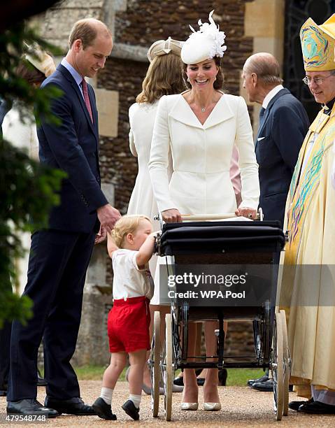 Catherine, Duchess of Cambridge, Prince William, Duke of Cambridge, Princess Charlotte of Cambridge and Prince George of Cambridge speak with...