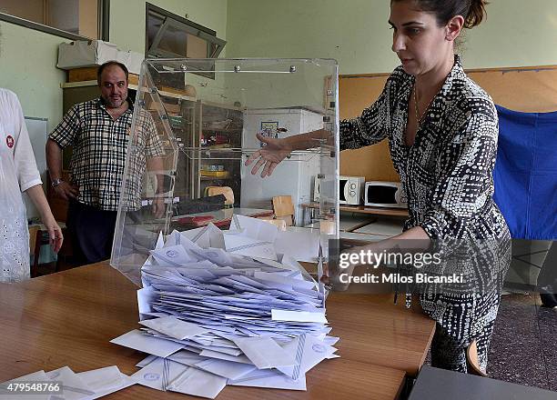 Voting officials count votes after polls are closed in Athens on July 5, 2015 in Athens, Greece. The people of Greece are going to the polls to...