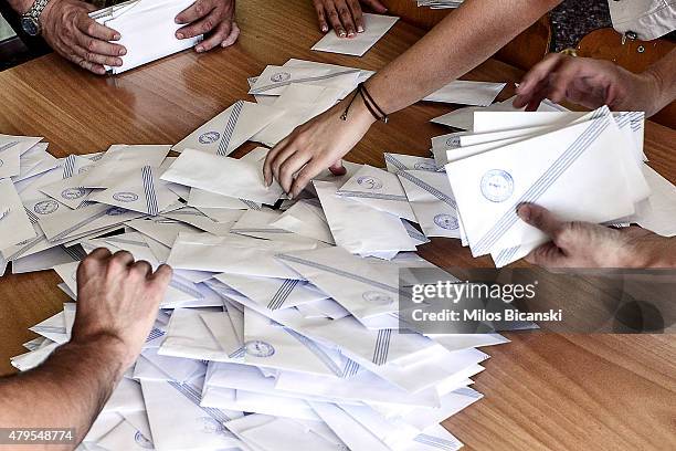 Voting officials count votes after polls are closed in Athens on July 5, 2015 in Athens, Greece. The people of Greece are going to the polls to...