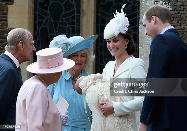 Catherine, Duchess of Cambridge, Prince William, Duke of Cambridge, Princess Charlotte of Cambridge and Prince George of Cambridge talk to Queen...