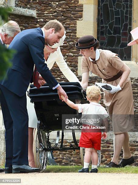 Catherine, Duchess of Cambridge, Prince William, Duke of Cambridge, Princess Charlotte of Cambridge and Prince George of Cambridge look on as Prince...