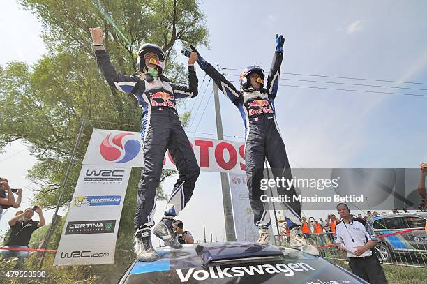 Sebastien Ogier of France and Julien Ingrassia of France celebrate their victory during Day Three of the WRC Poland on July 5, 2015 in Mikolajki,...