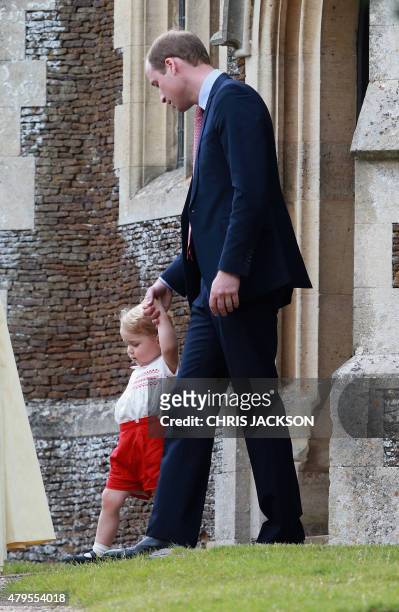 Prince George of Cambridge and father Prince William, Duke of Cambridge leave Charlotte's Christening at St. Mary Magdalene Church in Sandringham,...