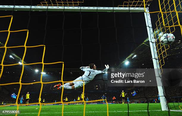 Roman Weidenfeller of Dortmund fails to stop a shot by Hulk of Zenit as he scores the opening goal during the UEFA Champions League round of 16,...