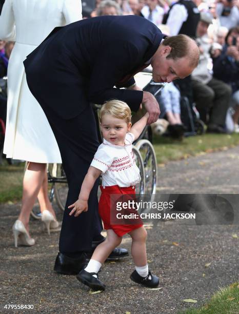 Britain's Prince William, Duke of Cambridge and Prince George of Cambridge leave Princess Charlotte of Cambridge's Christening at St. Mary Magdalene...
