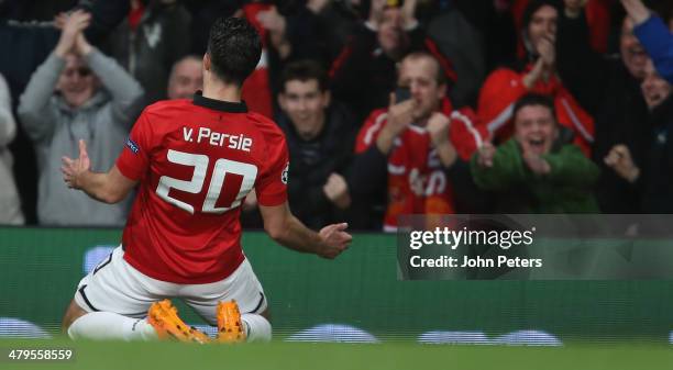 Robin van Persie of Manchester United celebrates scoring their third goal during the UEFA Champions League Round of 16 second leg match between...