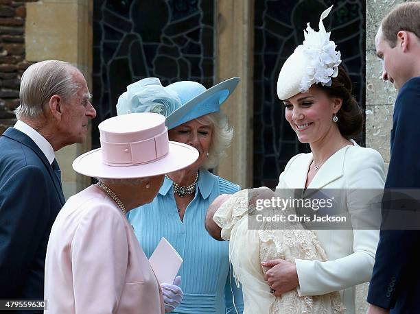 Catherine, Duchess of Cambridge, Prince William, Duke of Cambridge, Princess Charlotte of Cambridge and Prince George of Cambridge talk to Queen...