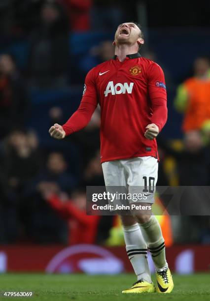 Wayne Rooney of Manchester United celebrates at the final whistle during the UEFA Champions League Round of 16 second leg match between Manchester...