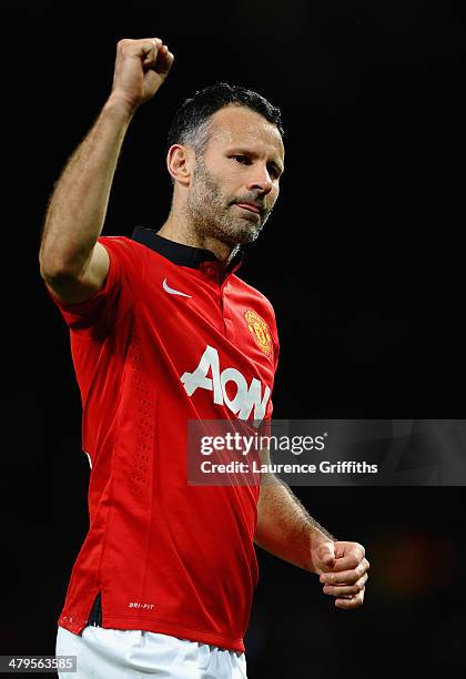 Ryan Giggs of Manchester United celebrates at the end of the UEFA Champions League Round of 16 second round match between Manchester United and...