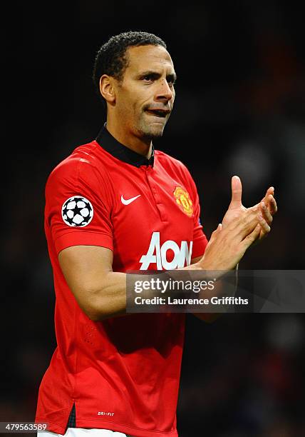 Rio Ferdinand of Manchester United celebrates at the end of the UEFA Champions League Round of 16 second round match between Manchester United and...