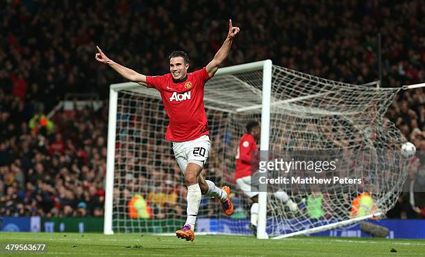 Robin van Persie of Manchester United celebrates scoring their second goal during the UEFA Champions League Round of 16 second leg match between...