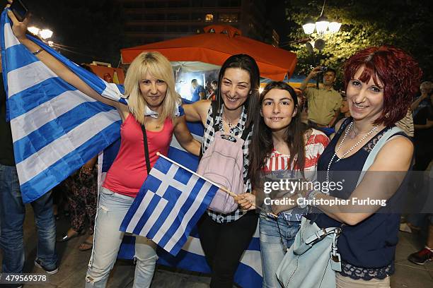 People celebrate in front of the Greek parliament as early opinion polls predict a win for the Oxi campaign in the Greek austerity referendum. Crowds...