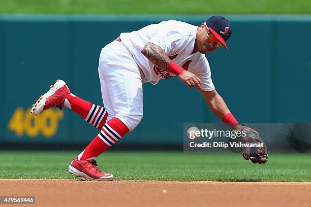 Kolten Wong of the St. Louis Cardinals fields a ground ball against the San Diego Padres in the first inning at Busch Stadium on July 5, 2015 in St....