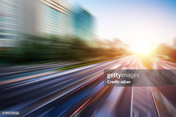 motion blur bild des verkehrs - bus road stock-fotos und bilder