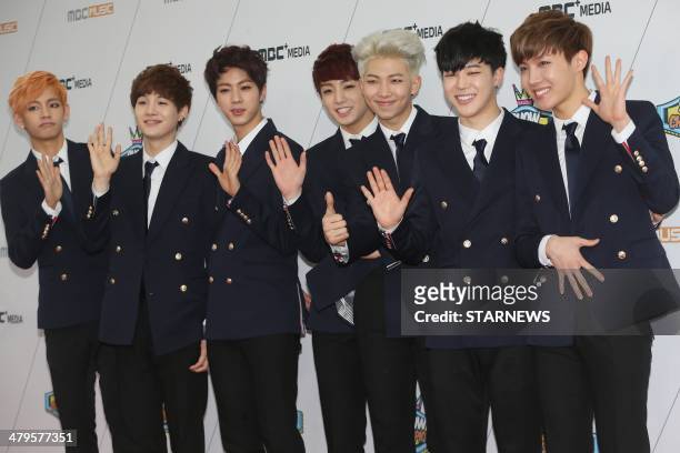 This photo taken on March 19, 2014 shows South Korean idol "Bangtan Boys" posing as they attend the 100th episode of MBC Show Champion in Seoul....