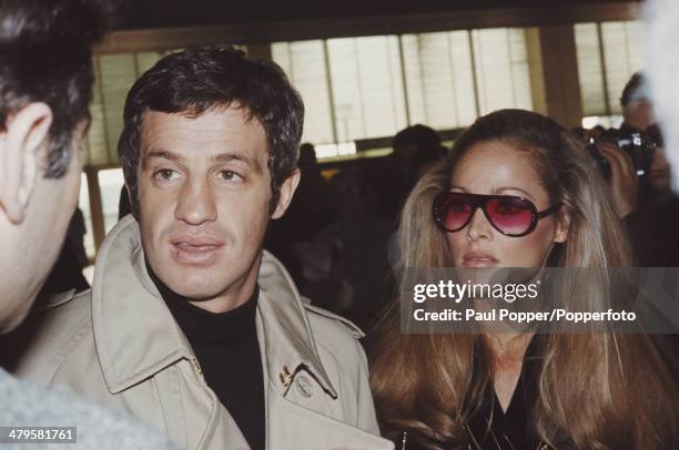 French actor Jean-Paul Belmondo with his partner, actress Ursula Andress at Orly Airport near Paris, 29th November 1968. They are flying to the...