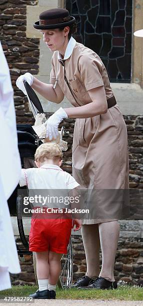 Prince George's nanny, Maria Teresa Turrion Borrallo helps arrange Princess Charlotte of Cambridge's pram as she leaves the Church of St Mary...