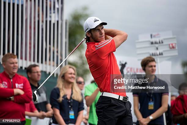 Footballer Gareth Bale tees off during the annual Celebrity Cup golf tournament at Celtic Manor Resort on July 4, 2015 in Newport, Wales. The...