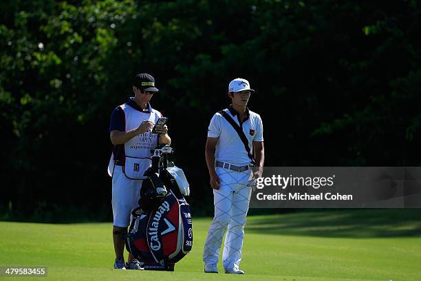 Danny Lee of New Zealand stands by his golf bag during the final round of the Puerto Rico Open presented by seepuertorico.com held at Trump...