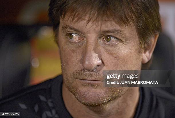 Argentina's Newell's Old Boys' coach Alfredo Berti gestures during the Copa Libertadores 2014 group 6 football match against Brazil's Gremio at...