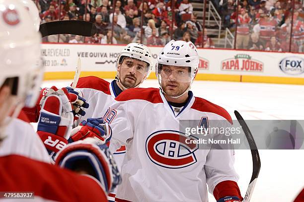 Andrei Markov of the Montreal Canadiens and teammates on the bench celebrate a goal against the Phoenix Coyotes at Jobing.com Arena on March 6, 2014...