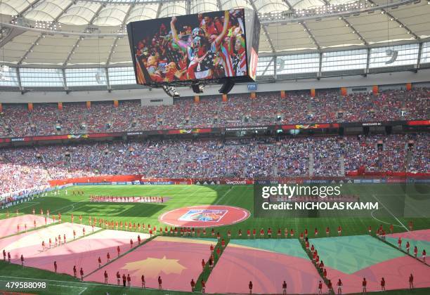 Fans are seen cheering on the stadium display before the 2015 FIFA Women's World Cup final between the USA and Japan at BC Place Stadium in...