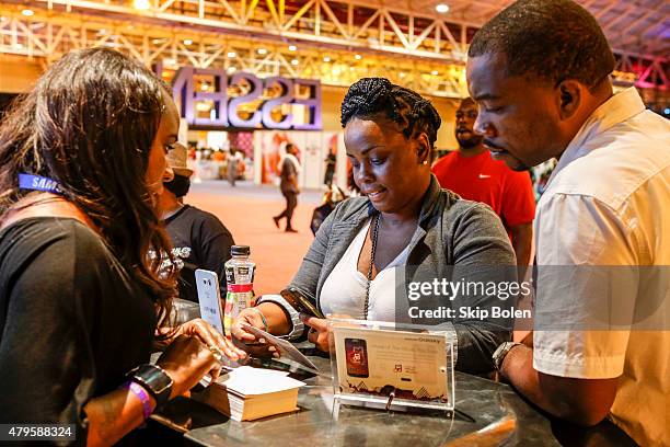 Festivalgoers attend the Samsung Galaxy Experience at ESSENCE Festival on July 5, 2015 in New Orleans, Louisiana.