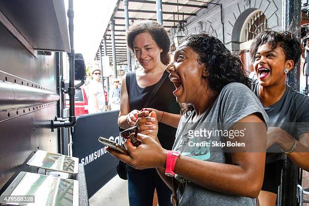 Festivalgoers attend the Samsung Galaxy Truck Experience at ESSENCE Festival on July 5, 2015 in New Orleans, Louisiana.