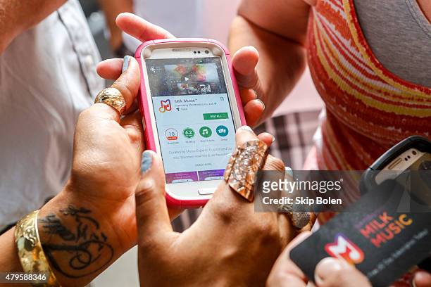 Festivalgoers attend the Samsung Galaxy Truck Experience at ESSENCE Festival on July 5, 2015 in New Orleans, Louisiana.