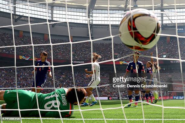 Goalkeeper Ayumi Kaihori of Japan is unable to save a shot by Carli Lloyd of the United States as Lloyd scores in the first half in the FIFA Women's...