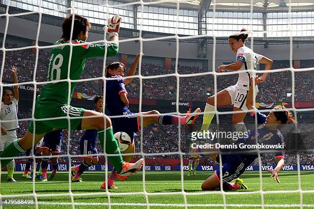 Carli Lloyd of the United States scores her second goal of the first half agaisnt goalkeeper Ayumi Kaihori of Japan in the FIFA Women's World Cup...