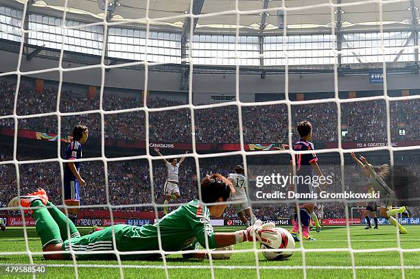 Goalkeeper Ayumi Kaihori of Japan is unable to save a shot by Carli Lloyd of the United States as Lloyd scores in the first half in the FIFA Women's...