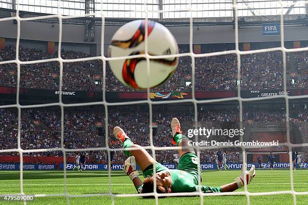 Goalkeeper Ayumi Kaihori of Japan reacts after she is unable to save a goal by Carli Lloyd of the United States as Lloyd scores her third goal in the...