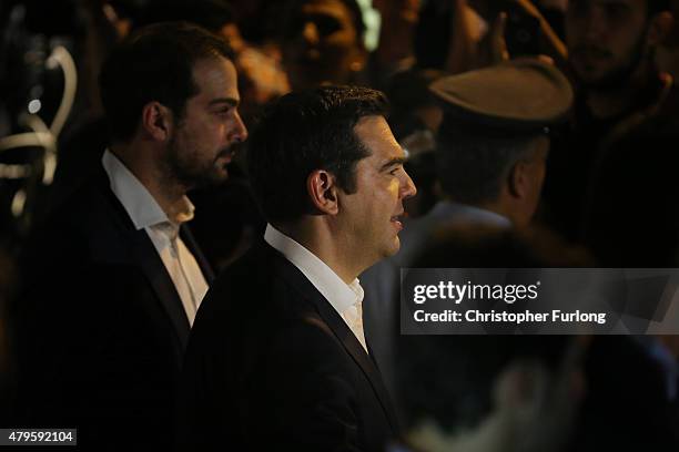 Greek Prime Minister Alexis Tsipras leaves his residence to visit the President of Greece after the people of Greece rejected the debt bailout by...
