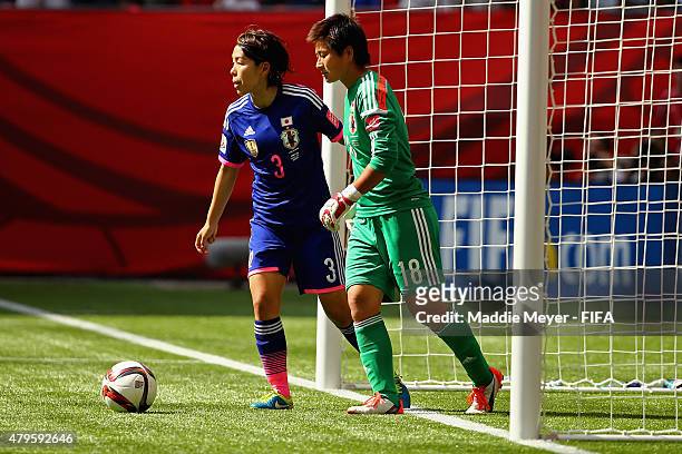 Azusa Iwashimizu of Japan with Ayumi Kaihori after allowing the fourth goal in the first half during the FIFA Women's World Cup 2015 final match...