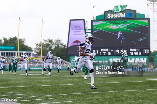 Jefferson of the Toronto Argonauts returns an interception the length of the field for a touchdown in the game between the Toronto Argonauts and...