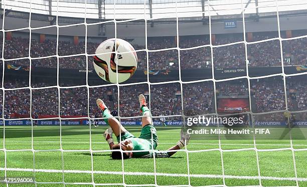 Japan goalkeeper Ayumi Kaihori fails to stop a long range shot from Carli Lloyd of USA during FIFA Women's World Cup 2015 Final between USA and Japan...