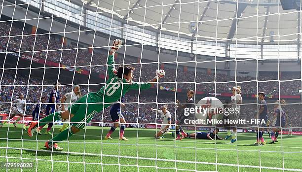 Carli Lloyd of USA scores her team's first goal despite the efforts of Japan goalkeeper Ayumi Kaihori during FIFA Women's World Cup 2015 Final...