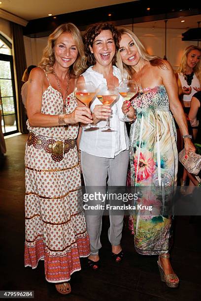 Caroline Beil, Isabel Varell and Xenia Seeberg attend the Wanawake Ladies Dinner at Hotel Zoo on July 05, 2015 in Berlin, Germany.
