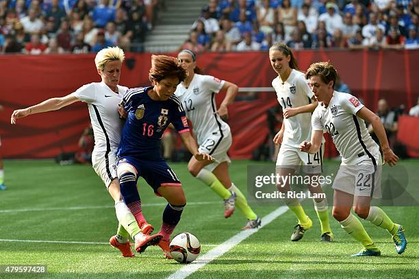 Mana Iwabuchi of Japan with the ball against Megan Rapinoe of the United States in the second half in the FIFA Women's World Cup Canada 2015 Final at...